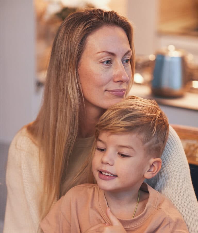 Parent calmly comforting child during a difficult moment, showing co-regulation in action